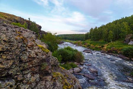 Many rapids with waterfalls, spray foam and whirlpools close-up, rotate camera. Ural region, Russia. The threshold Revunの写真素材