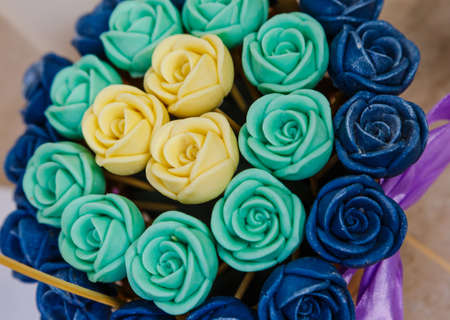 Beautiful bouquet of different flowers close up made of chocolate, edible sweet flower bouquet, original giftの写真素材
