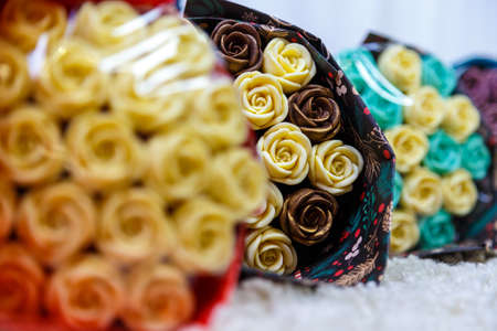 Gorgeous bouquet of roses and carnations with decorative dried flowers made from chocolateの写真素材
