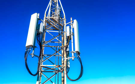 Panel antenna of GSM DCS UMTS LTE bands and radio unit are as part of communication equipment of basic stationの写真素材