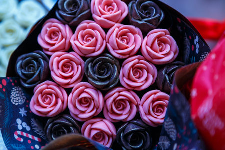 Gorgeous bouquet of roses and carnations with decorative dried flowers made from chocolate