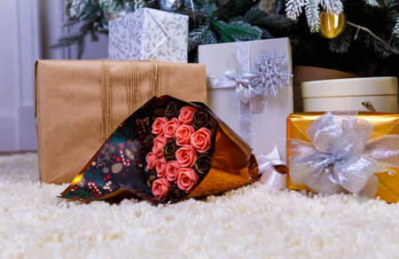 edible chocolate flowers, bouquet of roses among bright gift boxesの写真素材