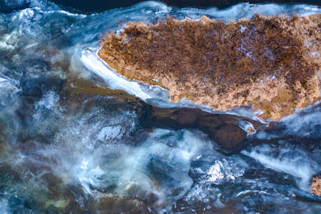 The texture of frozen water. Pattern of ice. Frost froze the river in winter. The surface of riverの写真素材