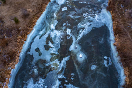 Abstract ice background. Blue background with cracks on the ice surfaceの写真素材