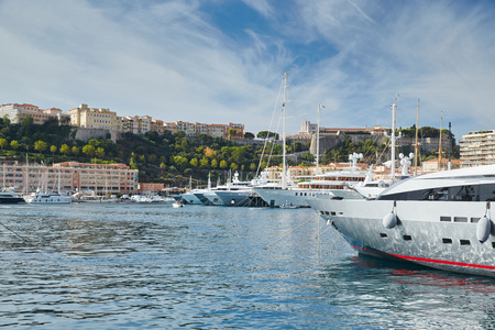 Monaco, Monte-Carlo, Monaco Ville, 4 sept 2015: Panorama Port Hercules, the preparation of the yacht show MYS in September, sunny day, many yachts and boats RIVA, Prince's Palace of Monacoのeditorial素材