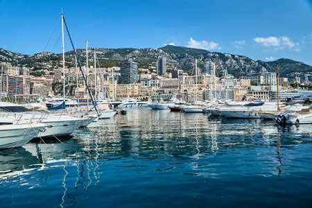 Monaco, Monte-Carlo, 06 August 2018: Tranquillity in port Hercules, is the parked boats, sunny day, many yachts and boats, a lot of Rivas boats, megayachts, massif of expensive real estateのeditorial素材
