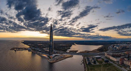 Russia, St.Petersburg, 06 May 2020: Aerial panoramic image of skyscraper Lakhta center at sunset, night illumination is on, It is the highest skyscraper in Europe, Completion of constructionのeditorial素材