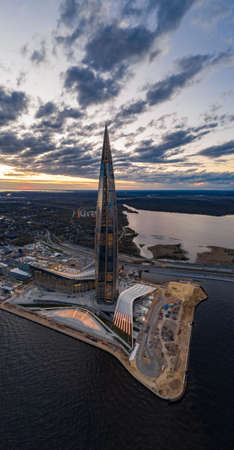 Russia, St.Petersburg, 06 May 2020: Aerial panoramic image of skyscraper Lakhta center at sunset, night illumination is on, It is the highest skyscraper in Europe, Completion of constructionのeditorial素材