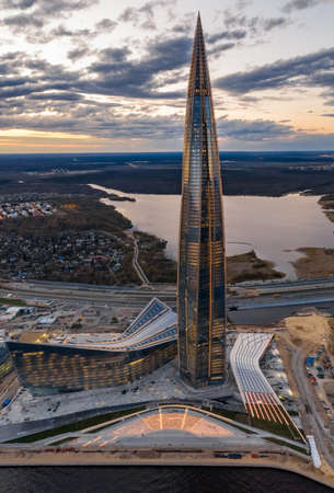 Russia, St.Petersburg, 06 May 2020: Aerial panoramic image of skyscraper Lakhta center at sunset, night illumination is on, It is the highest skyscraper in Europe, Completion of constructionのeditorial素材