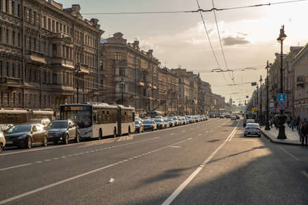 Russia, St.Petersburg, 09 June 2020: The architecture of Nevsky Prospect at sunset during pandemic of virus Covid-19, long shadows, traffic, dust, slow motion. High quality 4k footageのeditorial素材