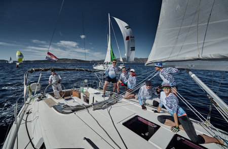 Croatia, Mediterranean Sea, 18 September 2019: The team of sailboat turns off the boat, sailboats...