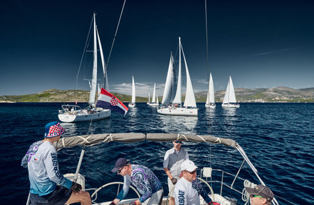 Croatia, Mediterranean Sea, 18 September 2019: Sailboats compete in a sail regatta, the team turns...