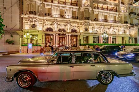 Monaco, Monte Carlo, 21 August 2019: Vintage Mercedes Benz car near the hotel Paris with night...