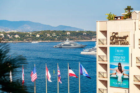 Monaco, Monte Carlo, 21 August 2017: The hotel Fairmont, flags of different countries on flagpoles,...