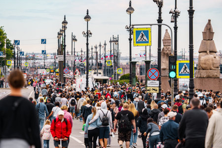 Russia, St. Petersburg, 31 July 2022: A lot of people during celebration of day of Navy on university embankment, lamppostsのeditorial素材