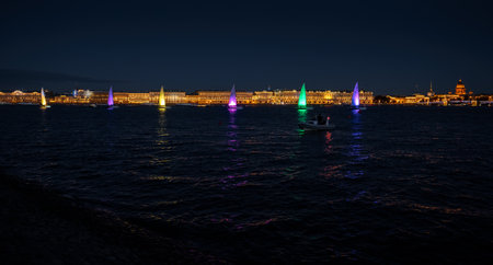 Russia, St. Petersburg, 07 August 2022: A few sailboats with sails illuminated in the tricolor of Russia go in the city center at the celebration of the opening of the sailing week, sightseeingのeditorial素材