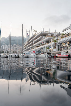 Monaco, Monte-Carlo, 18 October 2022: A lot of sailing boats are moored in new Yacht Club at the world championship of J70 class at sunset, port Herculesのeditorial素材