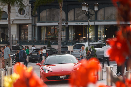 Monaco, Monte-Carlo, 22 October 2022: Square Casino Monte-Carlo at sunset, luxury cars, famous Hotel...