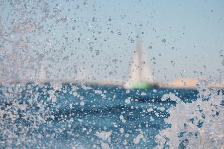 Sailing regatta in the Gulf of Finland at sunset, sailing yacht competing in a race, splashing water...