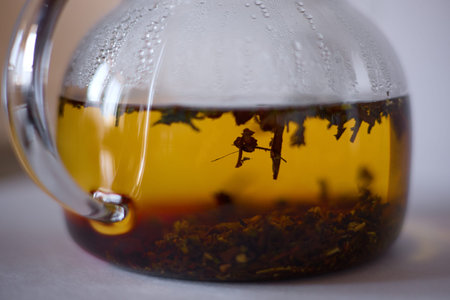 tea is brewed in a glass teapot, evaporation drops on the walls of the teapot
