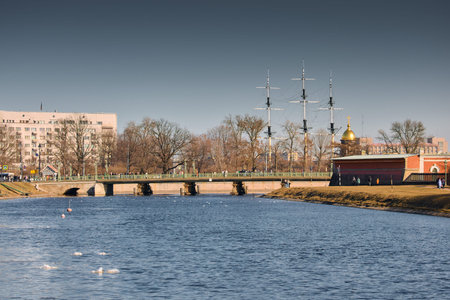 Russia, Saint-Petersburg, 27 March 2025: View on the Trinity bridge through iron railings of bridge...