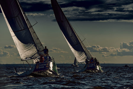 Russia, St.Petersburg, 17 August 2025: Sailing regatta in the Gulf of Finland at sunset, hot race of...