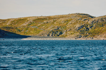 Round stones on the beach in Teriberka, the Barents Sea in the Murmansk region of northern Russiaの写真素材
