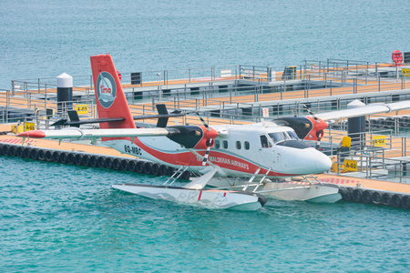Male, Maldives island, 02 December 2024: water planes moored at the piers at the airport, logistics with islands, boarding tourists on airplanes, amphibious aircraft take-offのeditorial素材