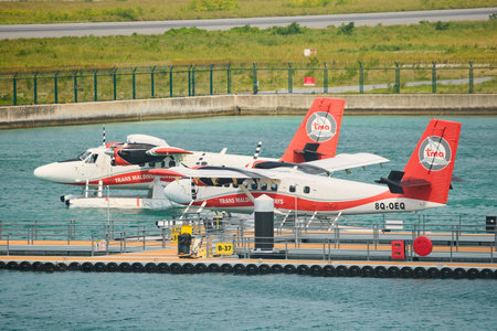 Male, Maldives island, 02 December 2024: water planes moored at the piers at the airport, logistics...
