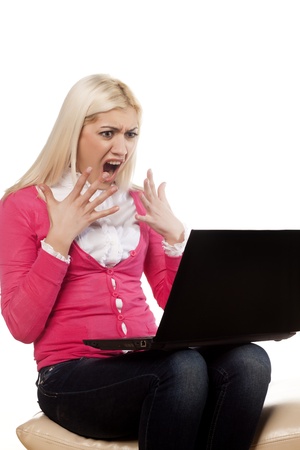 girl read bad news on the social network on a laptopの写真素材