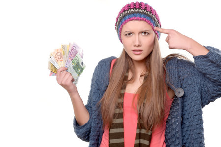 girl with money from questionable and puzzled faceの写真素材