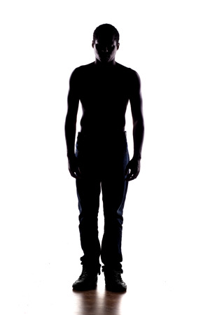 silhouette of a half-naked African man on a white backgroundの写真素材