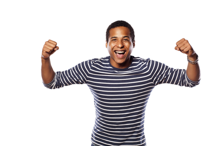 happy dark-skinned young man on a white backgroundの写真素材