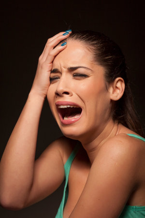 portrait of a young frightened weeping woman