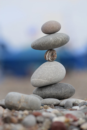 pile of balanced round stones on the beachの写真素材