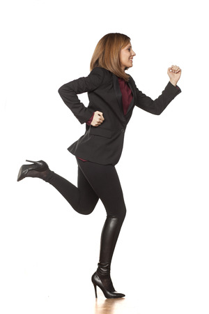 bustling business women running on a white backgroundの写真素材