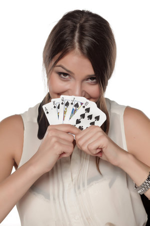 beautiful smiling woman holds in her hands a winning combination of cards