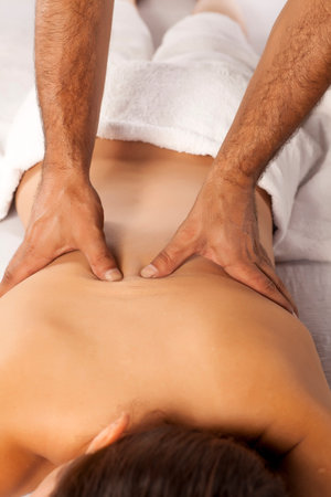 young woman enjoys back massage