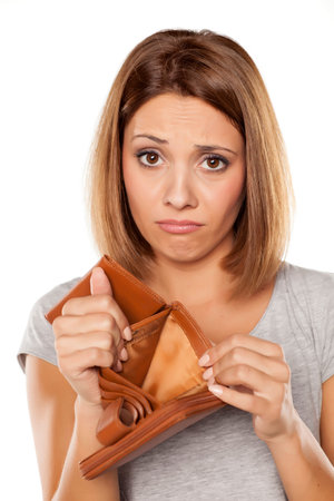 sad woman shows her empty wallet