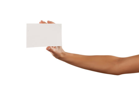 female hand holding a blank sheet of paper