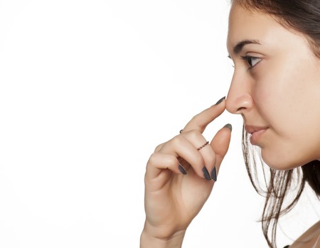 portrait of a girl touching her noseの写真素材