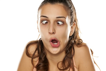 Young funny woman making silly faceの写真素材