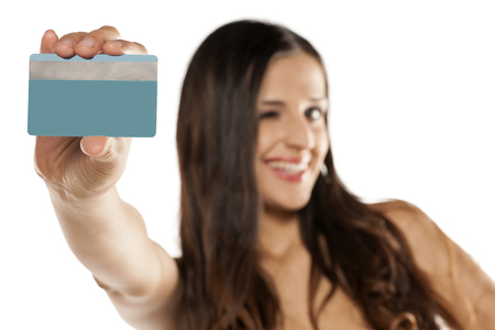 happy young beautiful woman holding a credit cardの写真素材