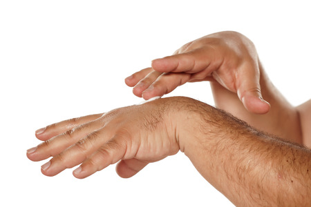 man applied the cream on his handsの写真素材