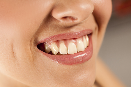 young smiling woman with beautiful teethの写真素材