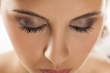young beautiful woman with closed eyes and makeupの写真素材