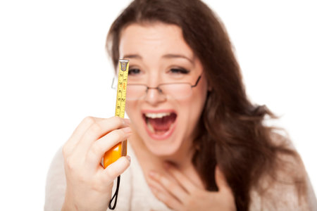 women laughed at the size shown on the measuring tape