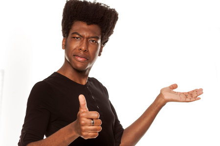 young handsome afro american guy stylish hipster thumbs up isolated on white background. advertising...