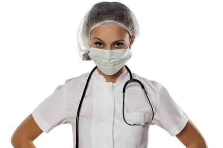 a young woman doctor with a mask and capの写真素材