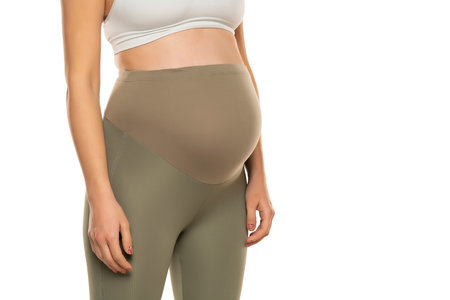 Clothes for pregnant women, gray tights with high waist isolated on white background, pregnancy...